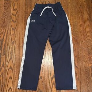 Under Armour boys XL pants. Navy with gray strip and white logo.
